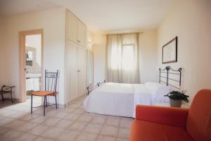Postel nebo postele na pokoji v ubytování Corte Di Ferro Hotel & Wellness Resort