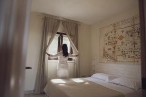 Postel nebo postele na pokoji v ubytování Corte Di Ferro Hotel & Wellness Resort