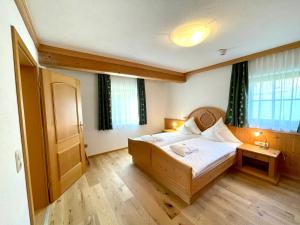 Postel nebo postele na pokoji v ubytování Naturhotel Reissenlehen