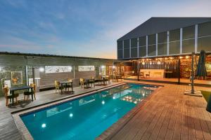 a pool on the roof of a building at Phudzi Hotel in Letlhakawe