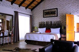 Postel nebo postele na pokoji v ubytování Lion's Guesthouse and The Buck&Lion Restaurant + 83 fotografií