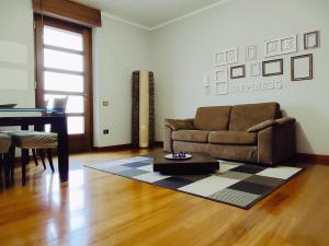 A seating area at Appartamento Incantevole La Coccola