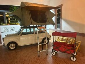 an old car with a tv on top of it at Home of Camper 659 in Seremban (16-18Pax) in Seremban