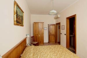 Postel nebo postele na pokoji v ubytování Hotel Margaret