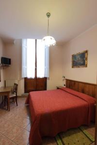Postel nebo postele na pokoji v ubytování Hotel Margaret