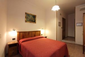 Postel nebo postele na pokoji v ubytování Hotel Margaret