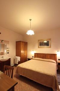 Posteľ alebo postele v izbe v ubytovaní Hotel Margaret