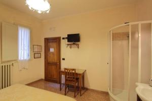 TV a/nebo společenská místnost v ubytování Hotel Margaret