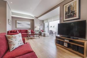 A television and/or entertainment centre at Luxury Acropolis View Duplex Penthouse in Thiseio 155m2