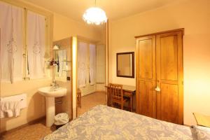 Postel nebo postele na pokoji v ubytování Hotel Margaret