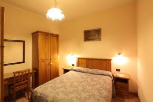 Postel nebo postele na pokoji v ubytování Hotel Margaret