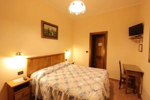 Postel nebo postele na pokoji v ubytování Hotel Margaret