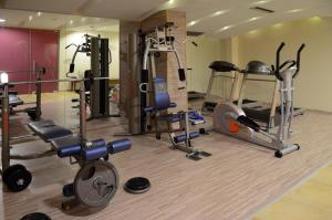 a gym with several different types of exercise equipment at Danai Hotel & Spa in Olympic Beach