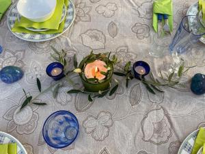 a table with a table cloth with a candle on it at Villa Helios in Pefkochori