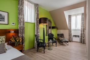 Posezení v ubytování Hotel De Pupiter