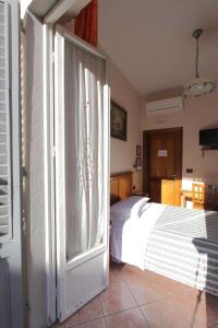 Postel nebo postele na pokoji v ubytování Hotel Margaret