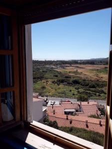Aussicht aus einem Fenster eines Gebäudes in der Unterkunft Casa Paola e Guido in Posada