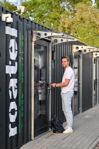 a man is standing inside of a shipping container at Roatel Hirschberg an der Bergstraße (A5) my-roatel-com in Hirschberg an der Bergstraße