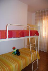 A bed or beds in a room at Homely flat few minutes from the beach - Beahost