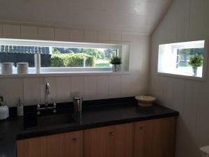 a kitchen with a sink and a window at Ottenstein in Hierden