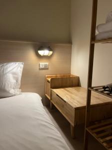 Letto o letti in una camera di 安平包棟Villa - 燈塔