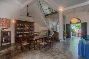 a dining room with a table and chairs at Villa Aurora, Galle Fort in Galle