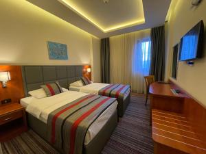Letto o letti in una camera di Spa Hotel Terme