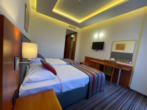Letto o letti in una camera di Spa Hotel Terme