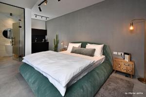 Postel nebo postele na pokoji v ubytování Y HOUSE SUITES