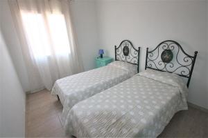 A bed or beds in a room at SHR Badesi
