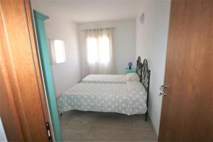 A bed or beds in a room at SHR Badesi