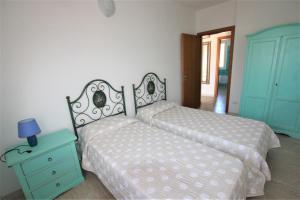 A bed or beds in a room at SHR Badesi
