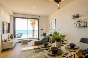 a living room with a view of the ocean at 136 Luxury Sea View - Alicante Holiday in La Mata