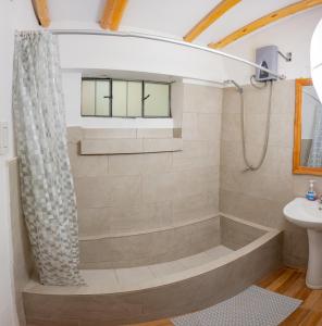 a bathroom with a tub and a sink at Santo Domingo in Ayacucho
