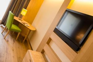 TV a/nebo společenská místnost v ubytování Hotel Hasslhof