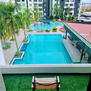 an overhead view of a swimming pool at a resort at B3 Superb PoolView Manhattan Waterpark Homestay Ipoh4-8Pax NETFLIX in Ipoh