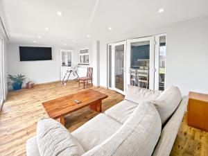 a living room with a couch and a table at Mariners House in King's Lynn