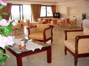 Χώρος καθιστικού στο Florena Hotel