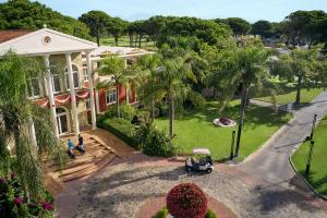 an aerial view of a house with a golf cart in front at ROBINSON NOBILIS - All inclusive in Belek