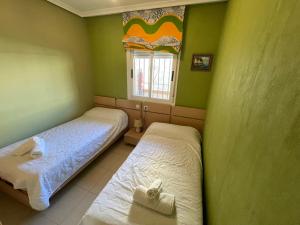 Postel nebo postele na pokoji v ubytování Apartamento Agua Marina I REF 038 + 18 fotografií
