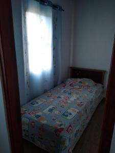 Cama o camas de una habitación en Quitinete aconchegante em Sobradinho, São Tomé das Letras