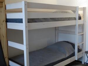 Poschodová posteľ alebo postele v izbe v ubytovaní L'Ancolie