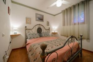 Ένα ή περισσότερα κρεβάτια σε δωμάτιο στο Casa Mamy a 150 metri dal mare