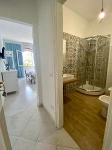 a bathroom with a shower and a sink and a toilet at Casa Malo' in Ischia Town +69 photos