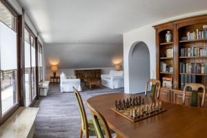 a living room with a table with a chessboard on it at Ferienhaus Wila in Wyhl