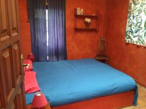 A bed or beds in a room at El Drago Rural House