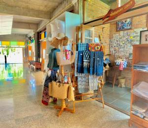 a store with a bunch of clothes on display at Hug Sakhonnakhon Hotel in Sakon Nakhon