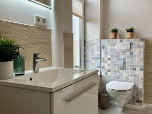 Koupelna v ubytování Duplex Villa Dünenbrise