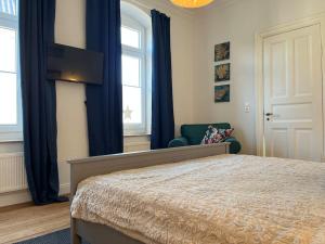Postel nebo postele na pokoji v ubytování Duplex Villa Dünenbrise