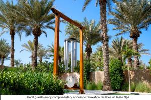 a playground with palm trees in a park at Jumeirah Dar Al Masyaf in Dubai